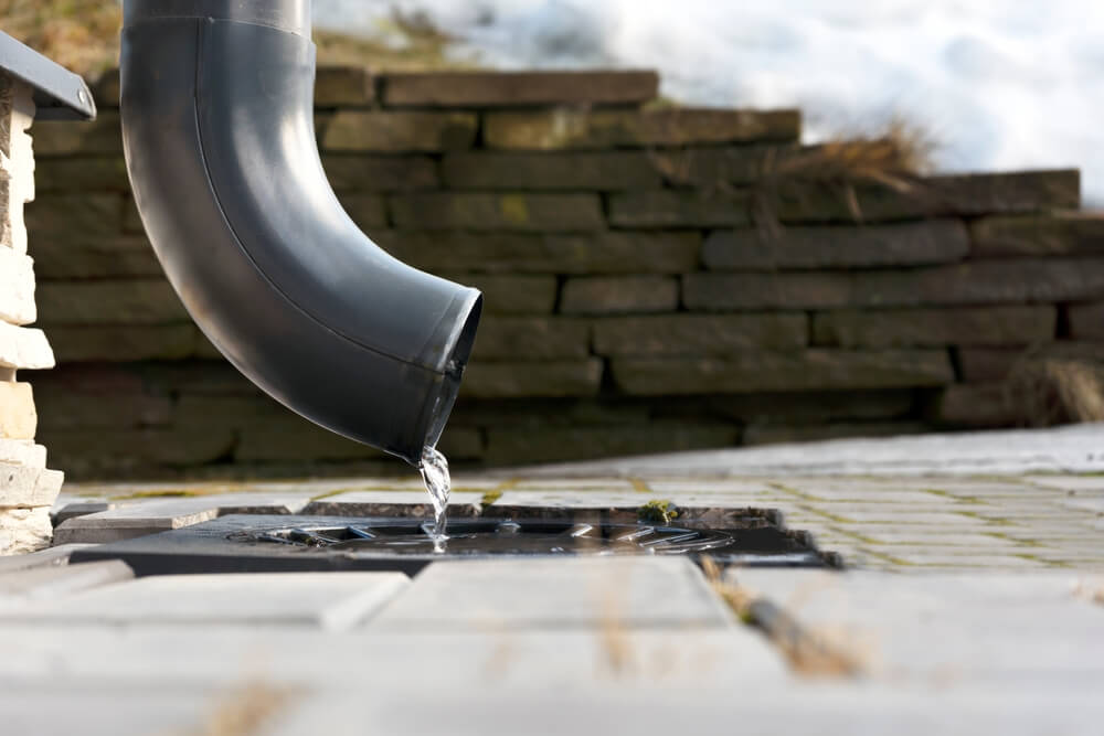Downspout extension connected | redirecting rainwater away from foundation